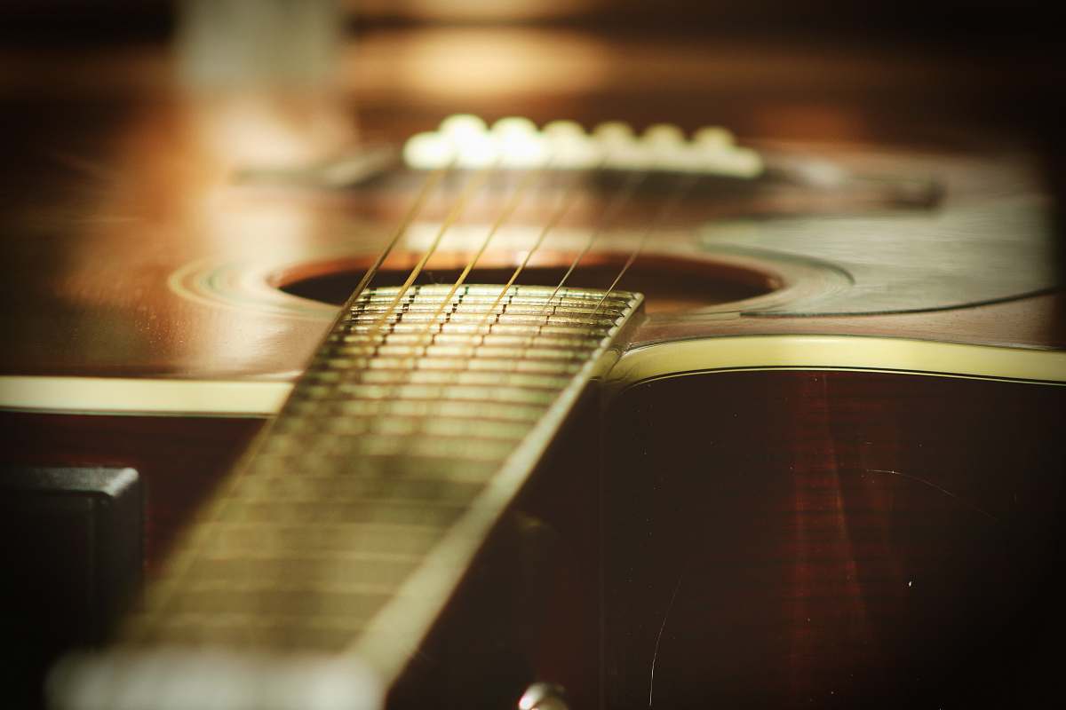 leisure activities selective focus photography of wooden classical guitar musical instrument
